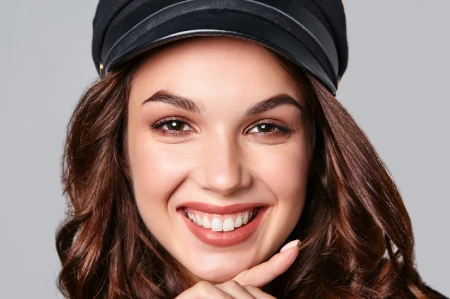 Smiling woman showing bright white teeth after teeth whitening in Cathedral City